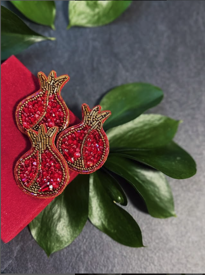 RED KET Jewellery - Elegant interior with sage green walls and terracotta furniture overlooking surreal landscape